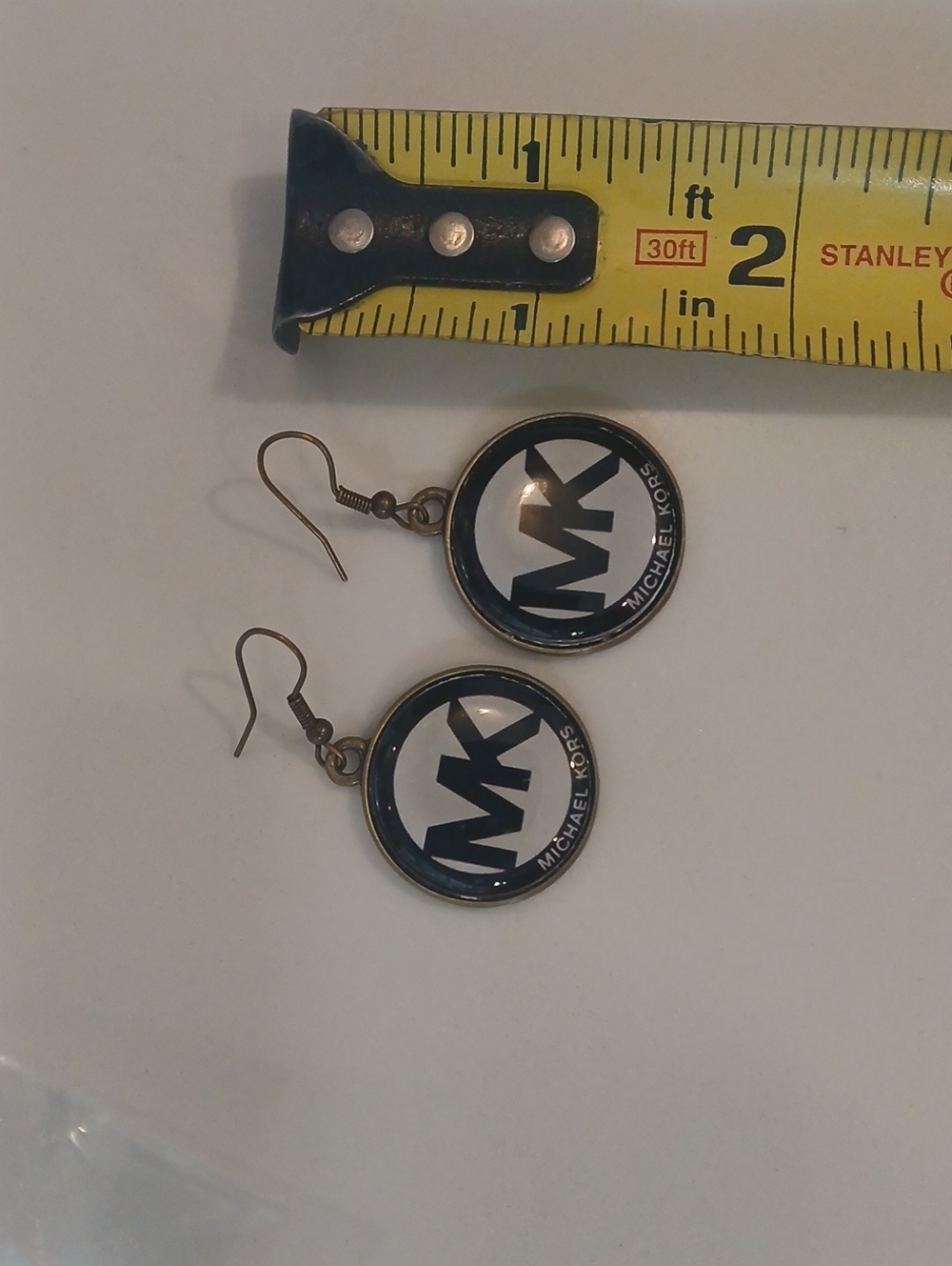 Michael Kors round logo dangle earrings feature the brand's iconic "MK" monogram - Picture 3 of 8